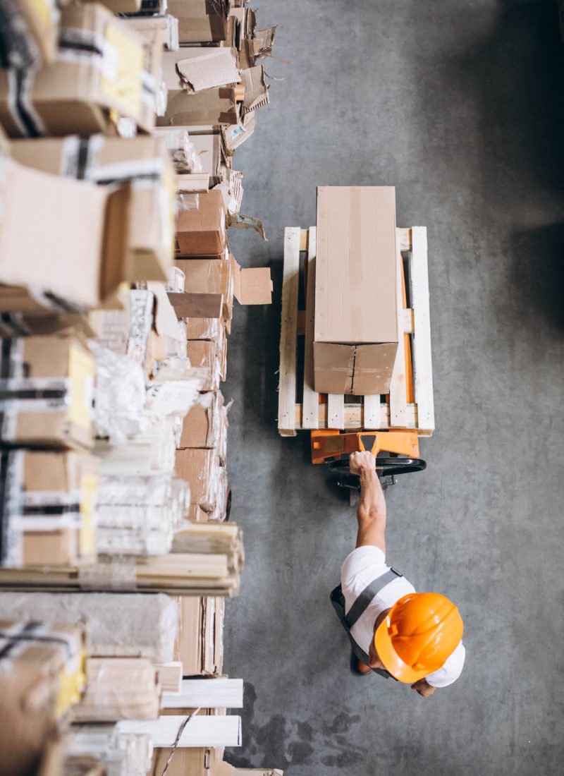 young-man-working-warehouse-with-boxes (1)